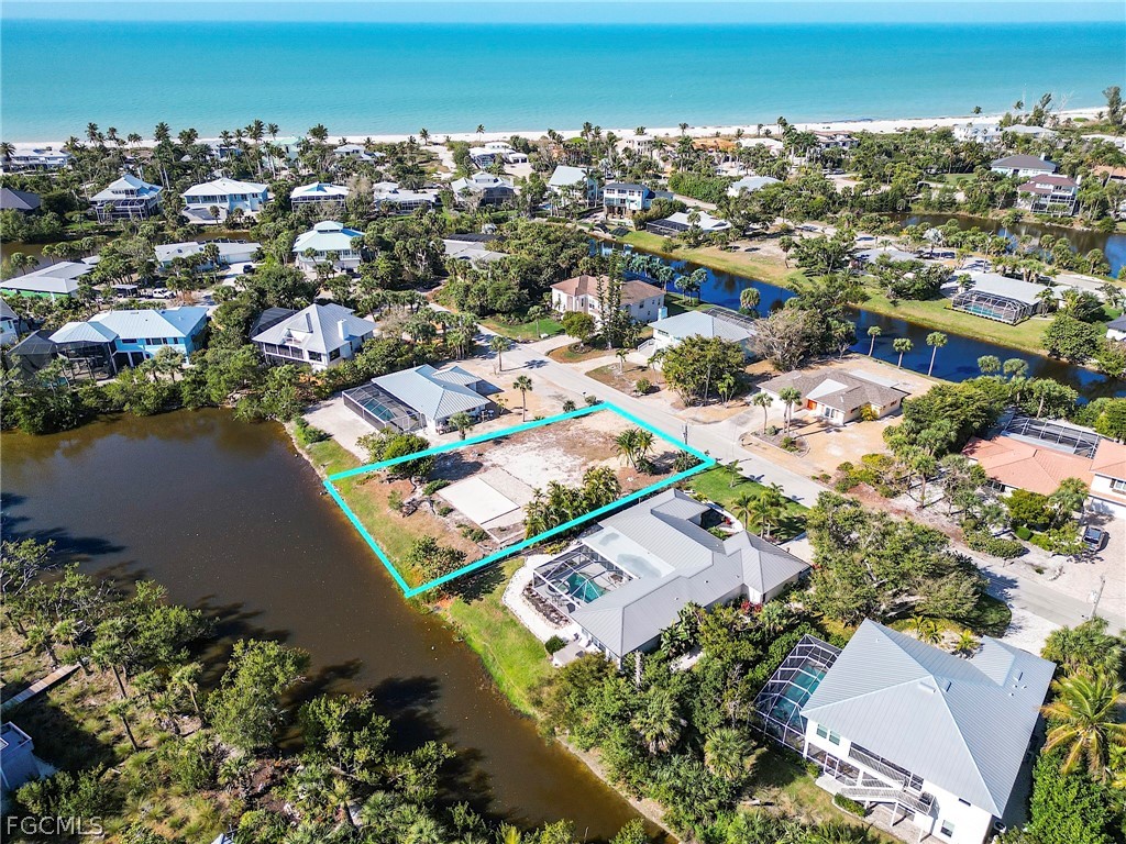 1016 Fish Crow Road Sanibel, FL 33957 - Photo 7 of 12 an aerial view of residential houses with outdoor space and trees
