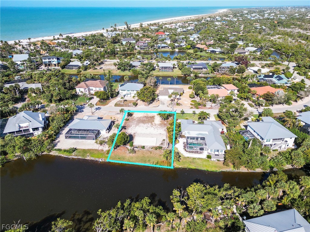 1016 Fish Crow Road Sanibel, FL 33957 - Photo 9 of 12 an aerial view of residential houses with outdoor space