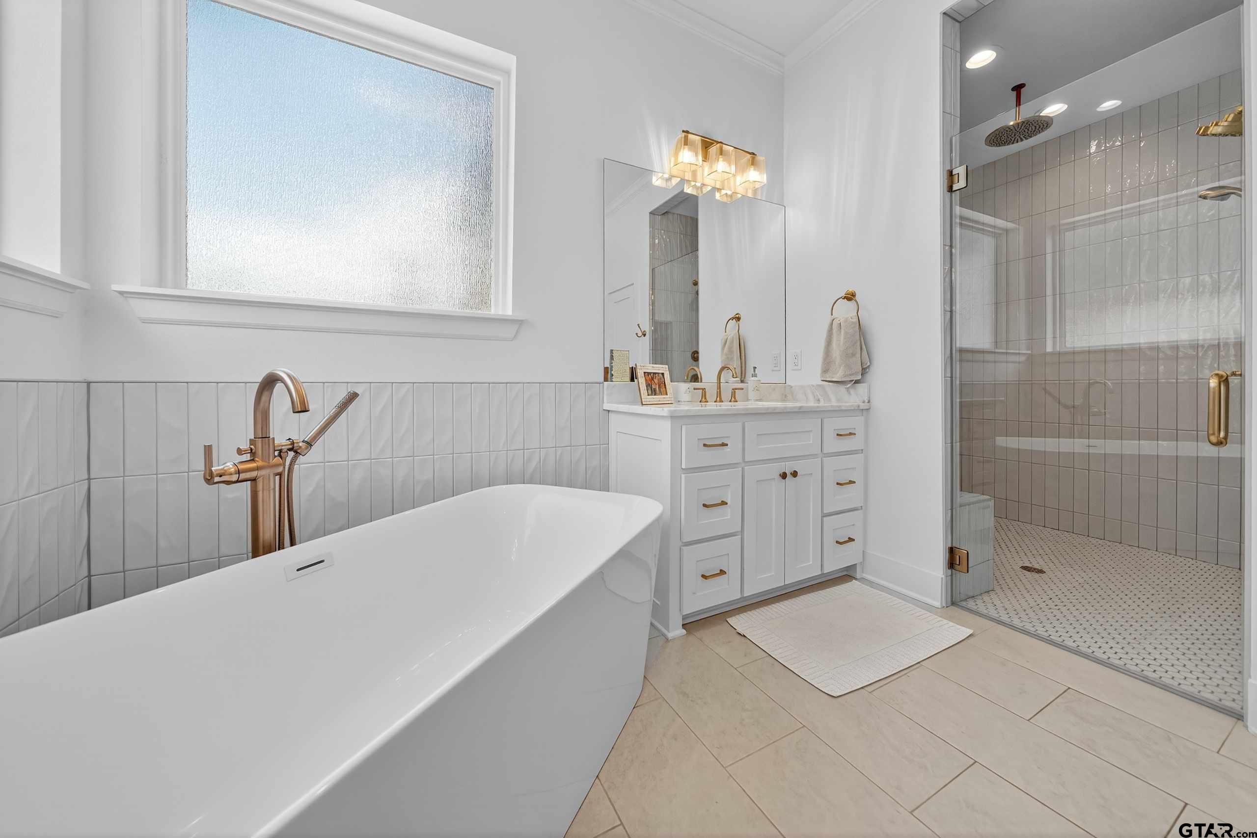 1572 Maple Lane Tyler, TX 75703 - Photo 23 of 43 a bathroom with a double vanity sink mirror and shower