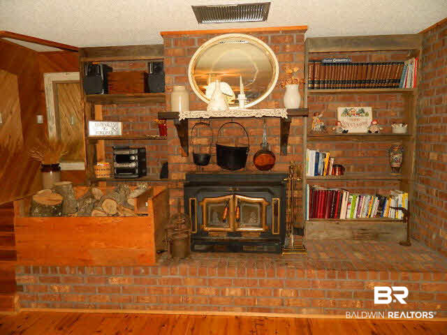21372 County Road 49 Silverhill, AL 36576 - Photo 40 of 50 wood fireplace