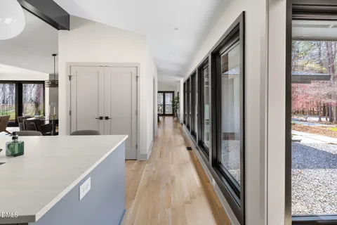 a bathroom with a double vanity sink a mirror a bathtub and shower