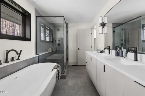 a bathroom with a sink toilet and mirror