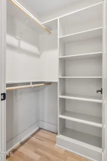 a view of a patio with table and chairs and wooden floor