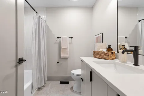 a view of a swimming pool with a yard and large trees