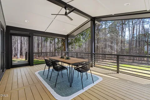 a view of a lush green forest with lots of trees