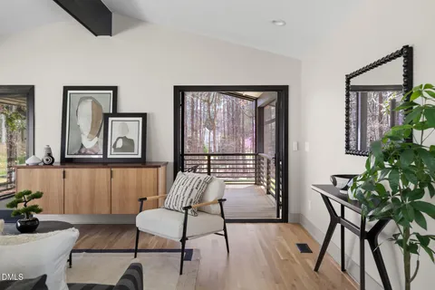 a bedroom with a bed and a potted plant