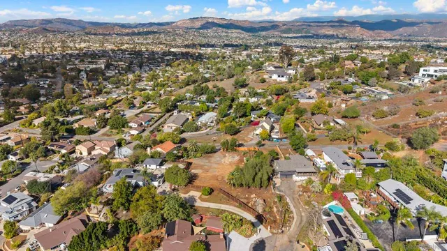 an aerial view of residential houses with outdoor space