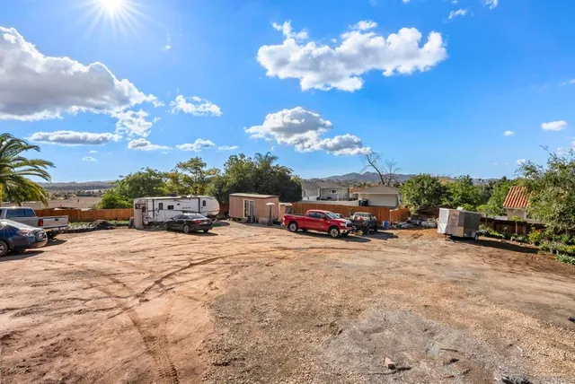 a view of a swimming pool with an outdoor seating and a garden