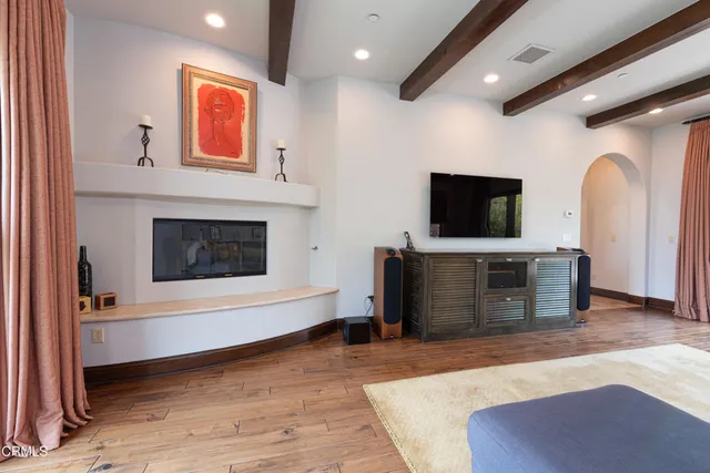 a bathroom with a sink a large mirror and a bathtub