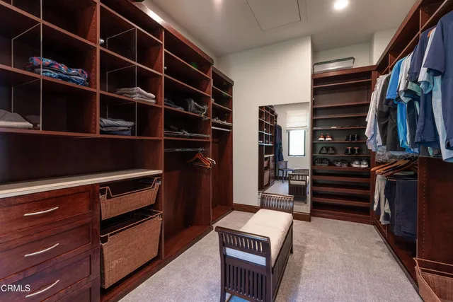 a view of a patio with couches table and chairs and potted plants
