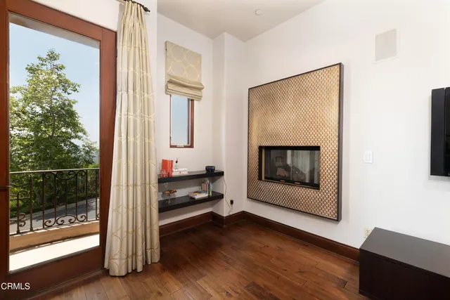 a view of a patio with table and chairs and potted plants