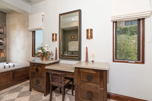 an aerial view of residential houses with outdoor space and parking