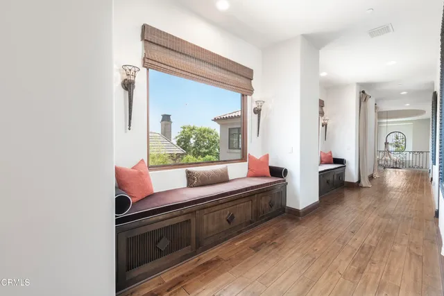 a view of a backyard with couches and plants