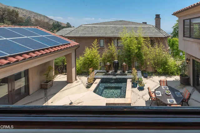 an aerial view of a residential apartment building with a yard