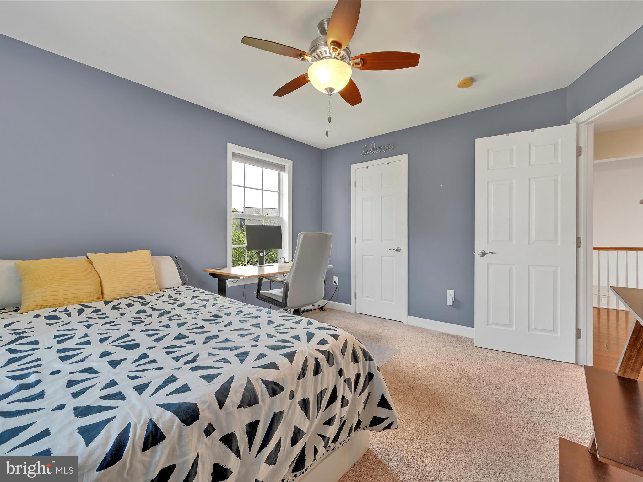 623 Courthouse Circle Lititz, PA 17543 - Photo 20 of 32 a bedroom with a large bed and a chandelier