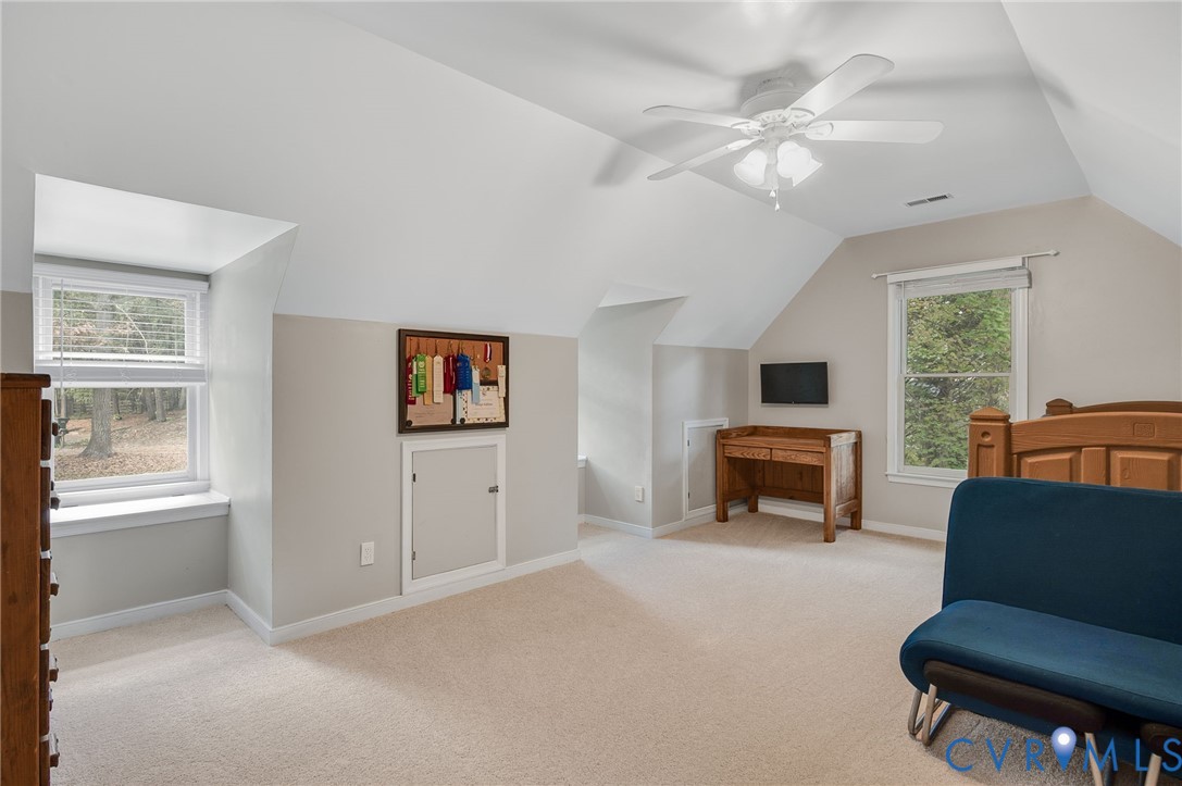 8701 Overhill Road Henrico, VA 23229 - Photo 27 of 35 Bedroom with carpet floors, vaulted ceiling, and c