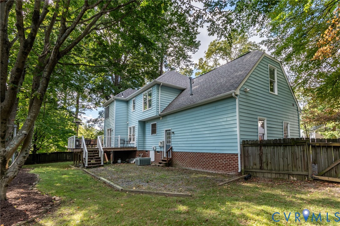 8701 Overhill Road Henrico, VA 23229 - Photo 31 of 35 Back of house featuring a shingled roof, a fenced