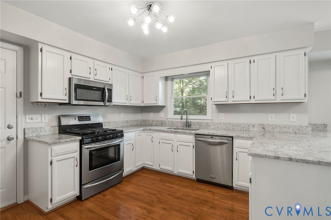 8701 Overhill Road Henrico, VA 23229 - Photo 8 of 35 Kitchen featuring white cabinetry, appliances with