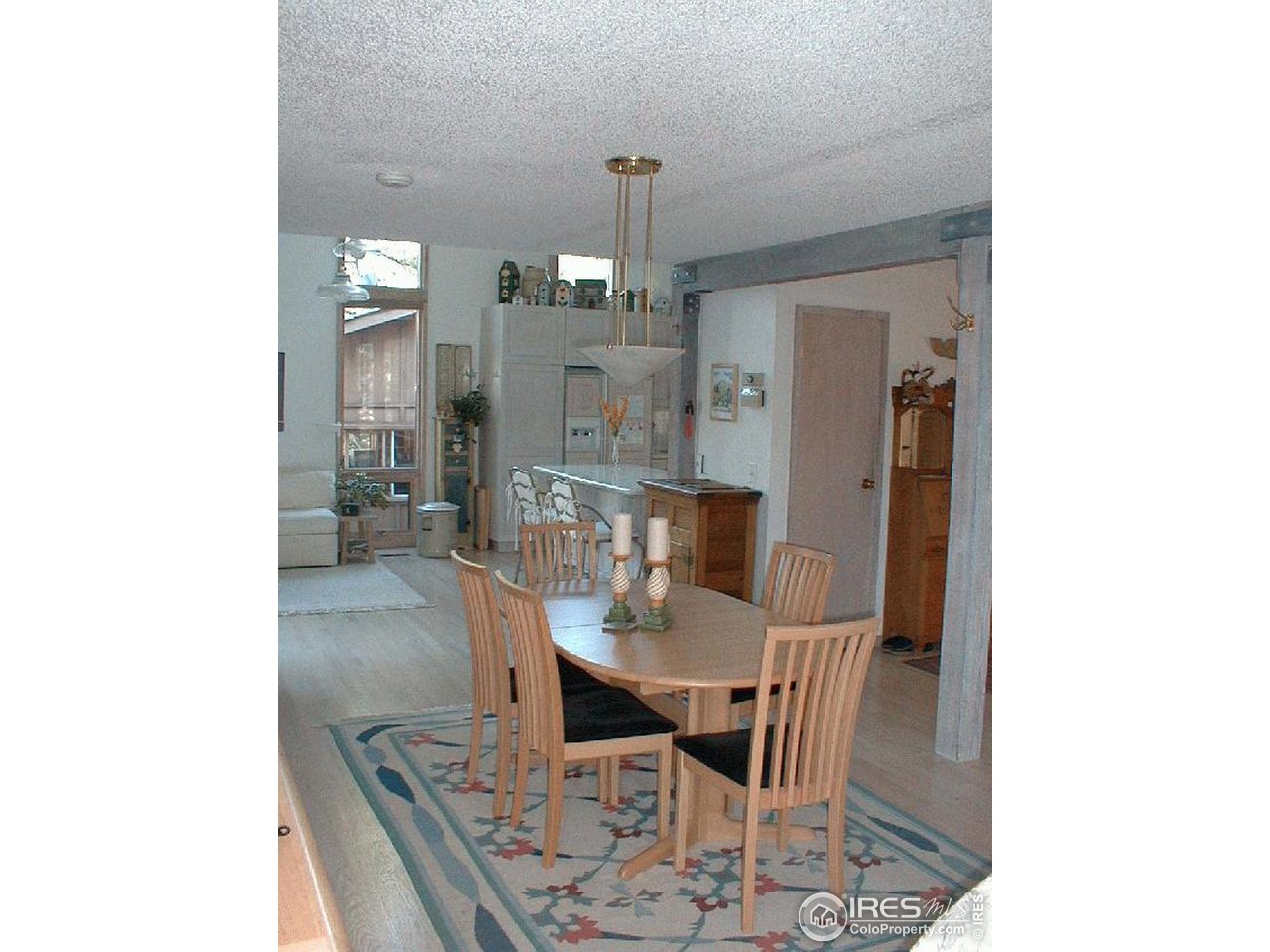 207 East Kelly Road Boulder, CO 80302 - Photo 4 of 10 a view of a dining room with furniture and chandelier