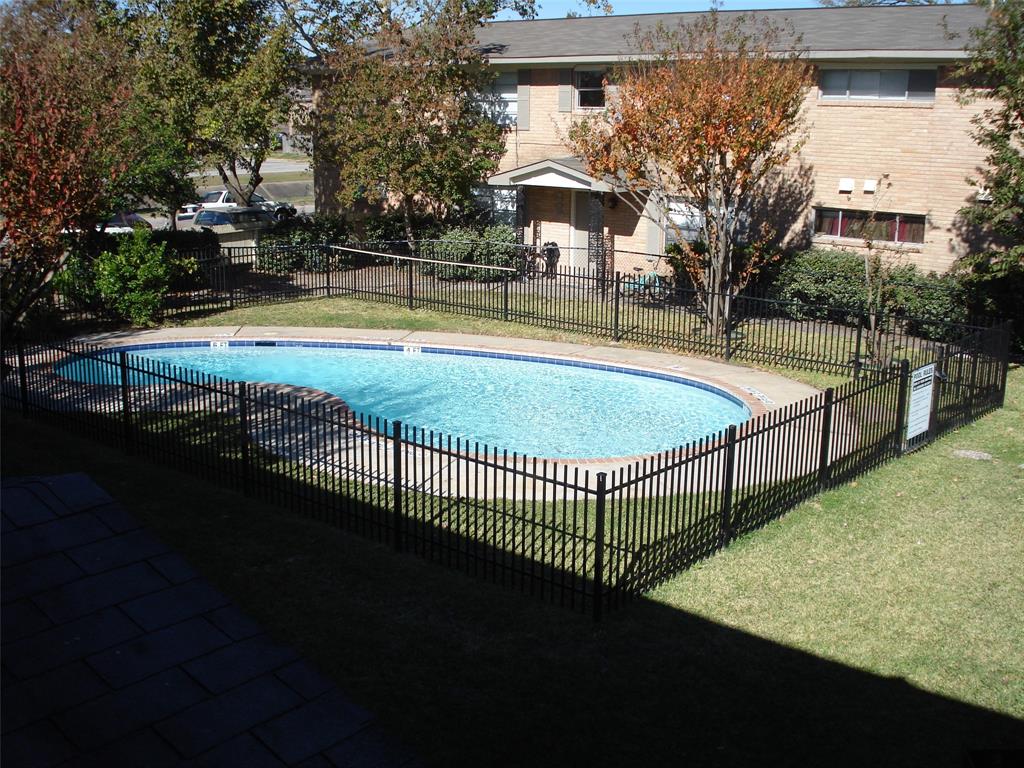 a view of a swimming pool with an outdoor space and seating area