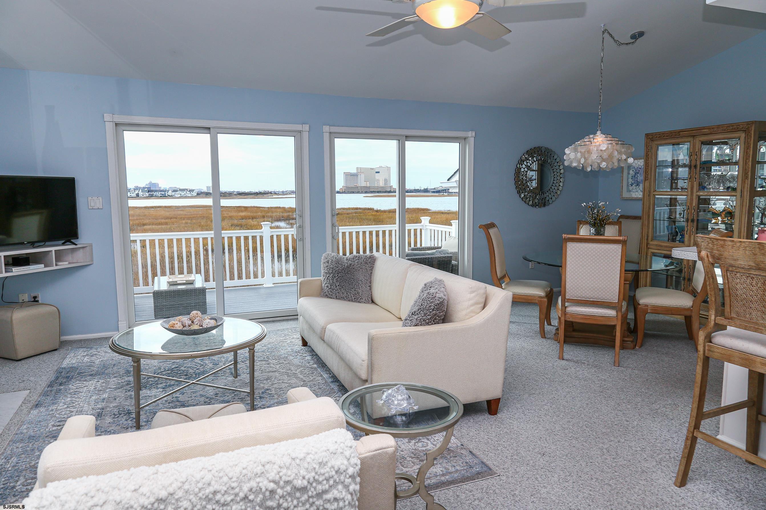 12 Gull Cove Brigantine, NJ 08203 - Photo 12 of 50 a living room with furniture a lamp and a large window