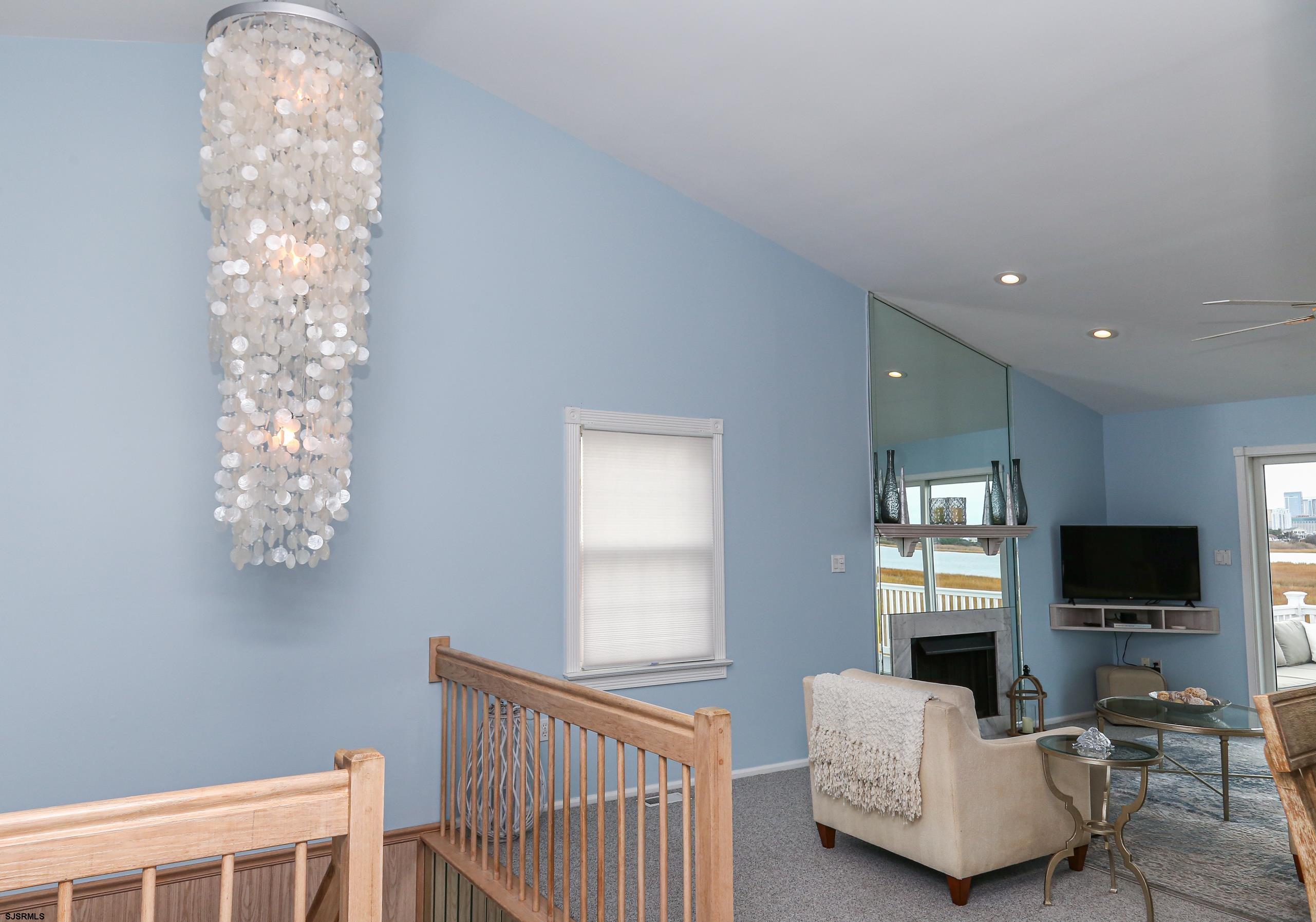 12 Gull Cove Brigantine, NJ 08203 - Photo 15 of 50 a living room with furniture and a flat screen tv