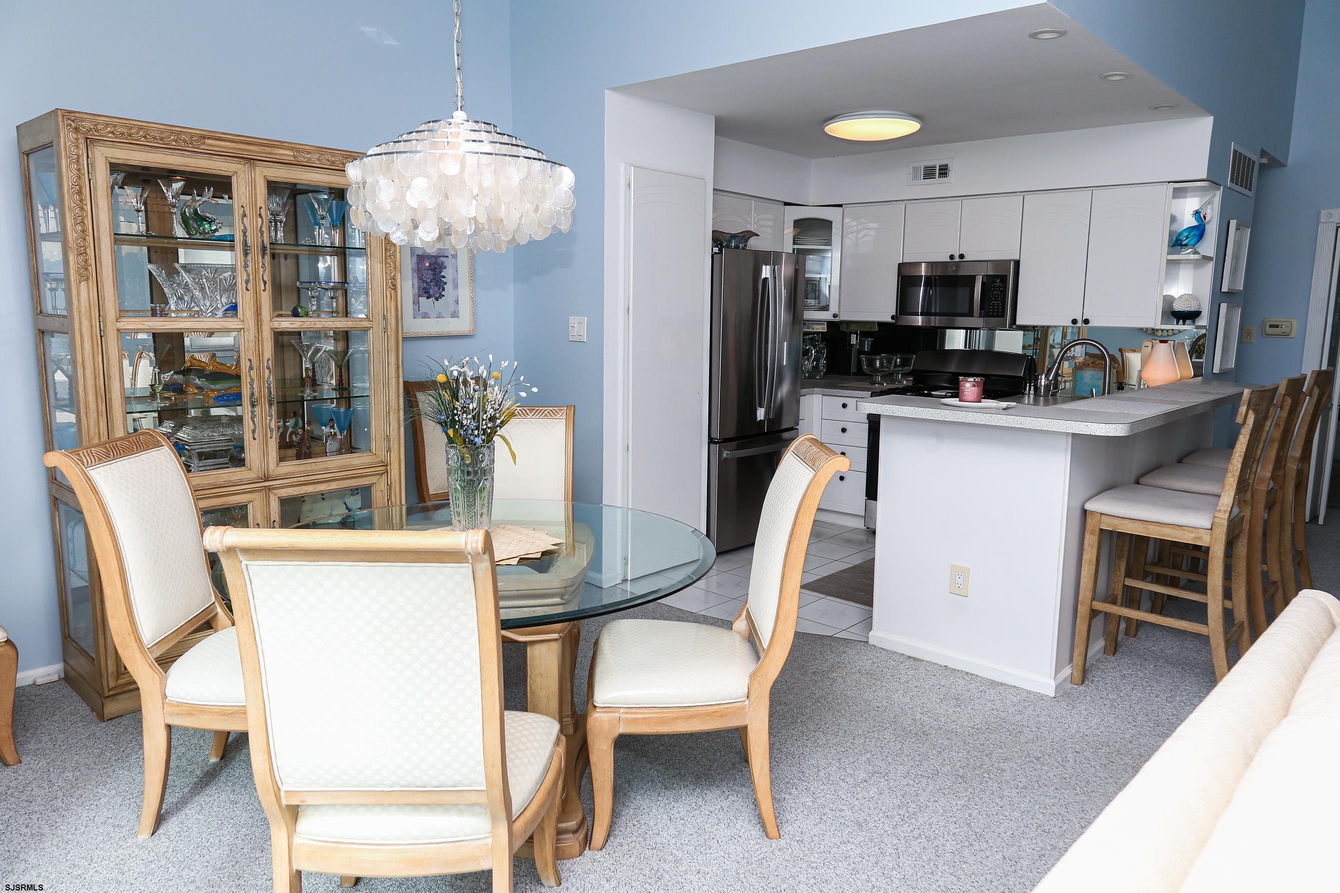 12 Gull Cove Brigantine, NJ 08203 - Photo 18 of 50 a view of a dining room with furniture and chandelier