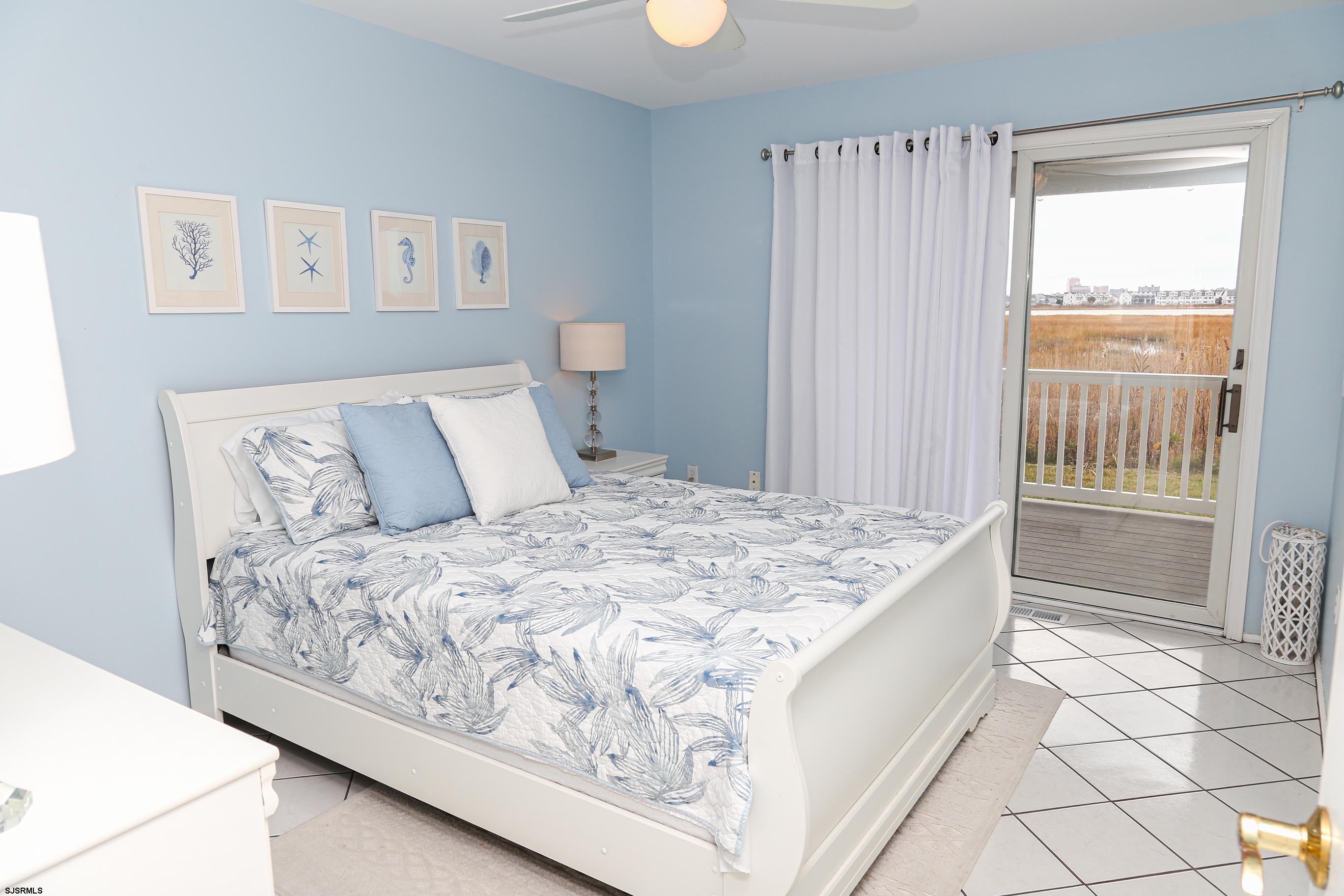 12 Gull Cove Brigantine, NJ 08203 - Photo 19 of 50 a bedroom with a bed and a window