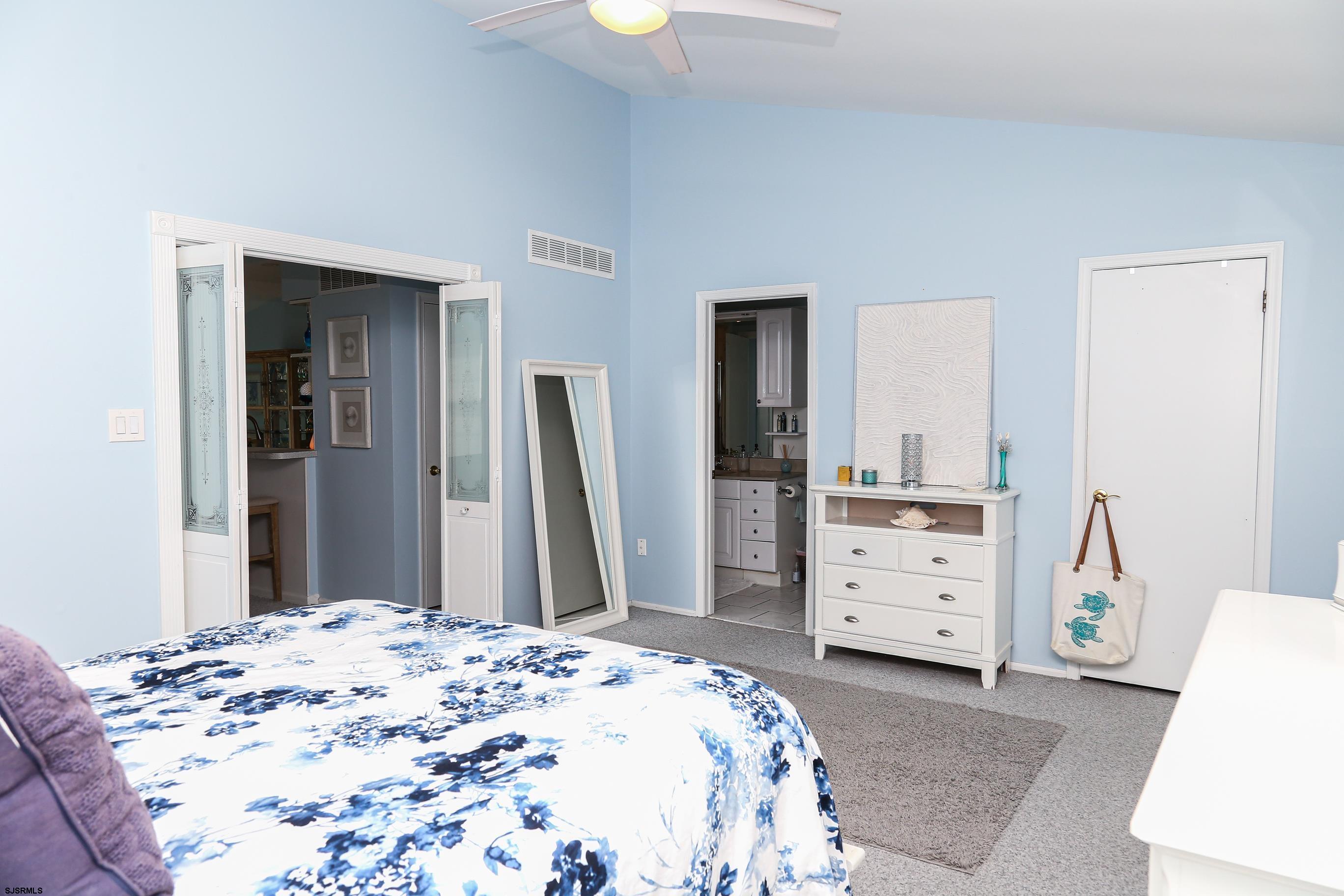 12 Gull Cove Brigantine, NJ 08203 - Photo 22 of 50 a bedroom with a bed and a dresser