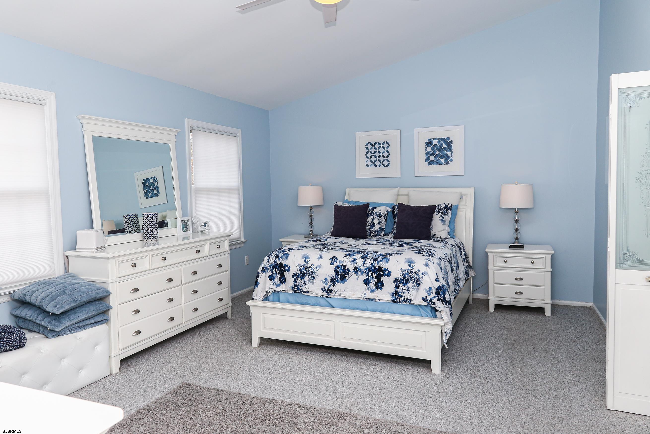 12 Gull Cove Brigantine, NJ 08203 - Photo 27 of 50 a bedroom with a bed and a dresser