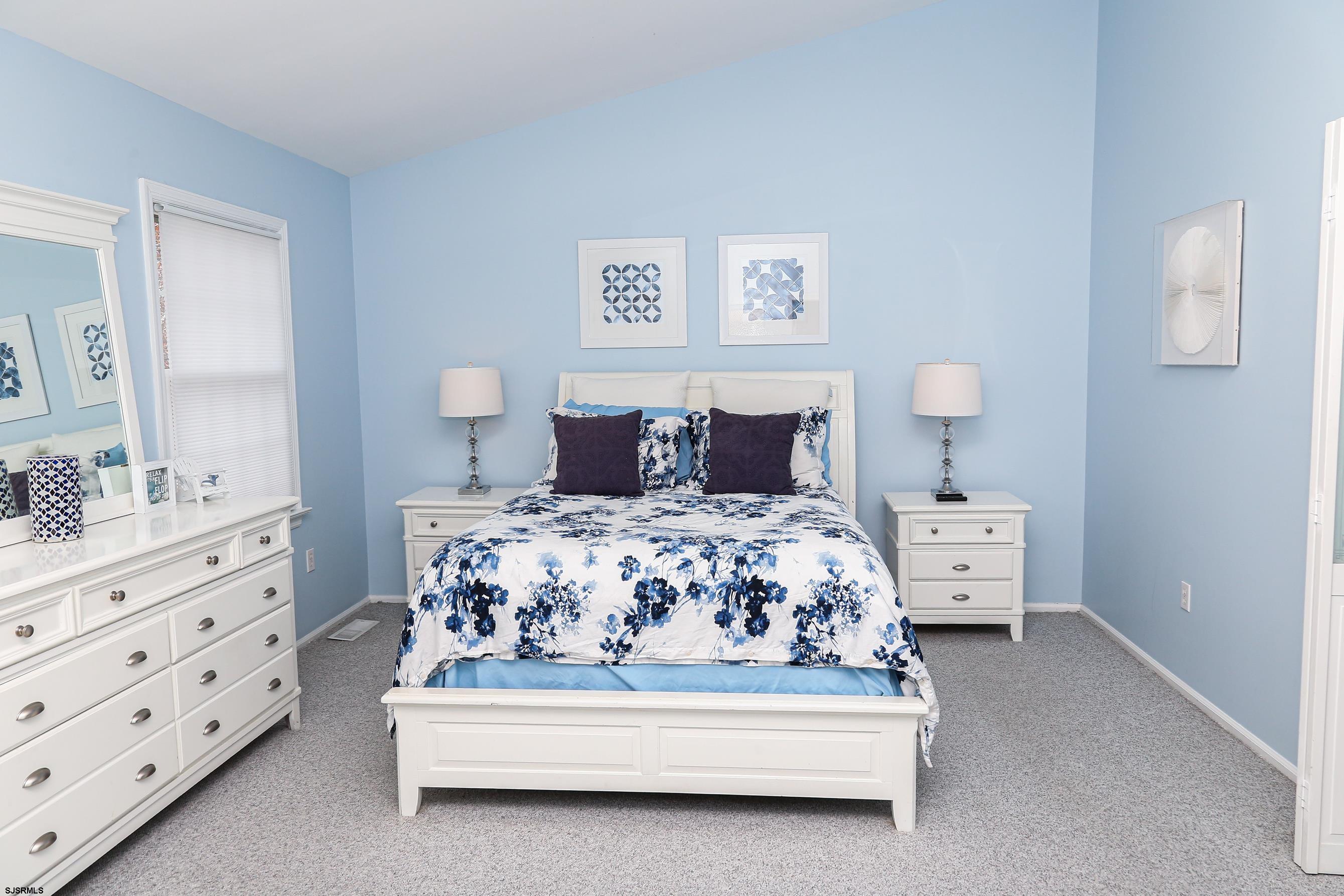 12 Gull Cove Brigantine, NJ 08203 - Photo 28 of 50 a bedroom with a bed and a dresser