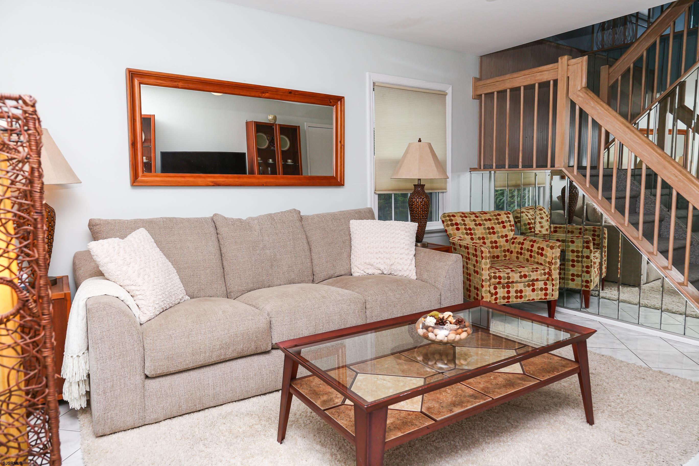 12 Gull Cove Brigantine, NJ 08203 - Photo 30 of 50 a living room with furniture and a stairs