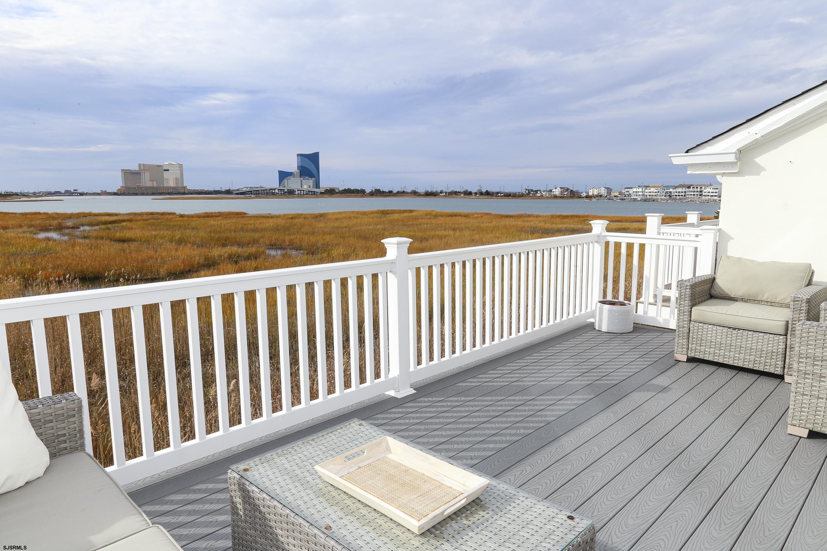 12 Gull Cove Brigantine, NJ 08203 - Photo 36 of 50 a view of a balcony with wooden floor and city view