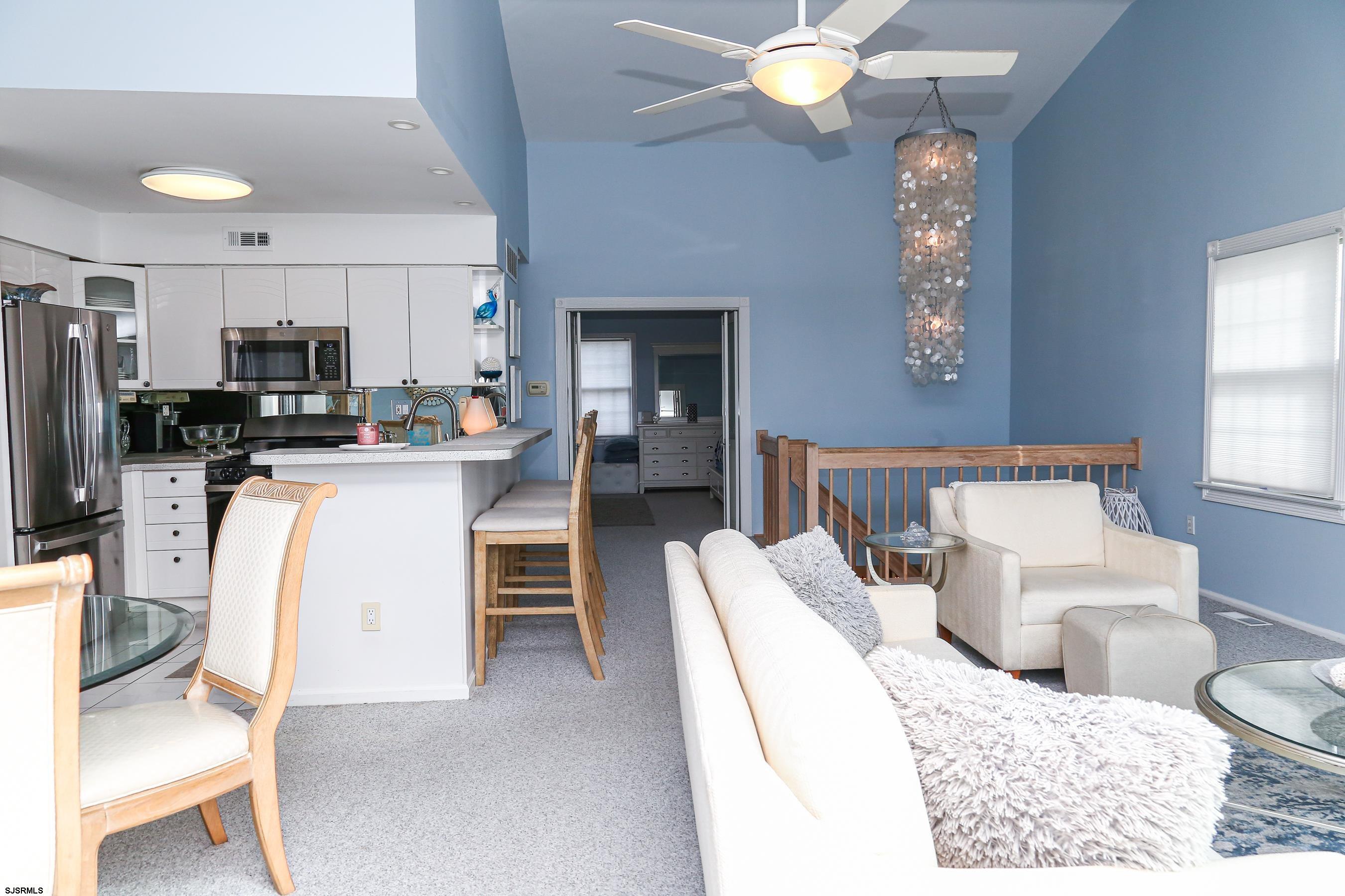 12 Gull Cove Brigantine, NJ 08203 - Photo 9 of 50 a living room with stainless steel appliances kitchen island granite countertop furniture and a window