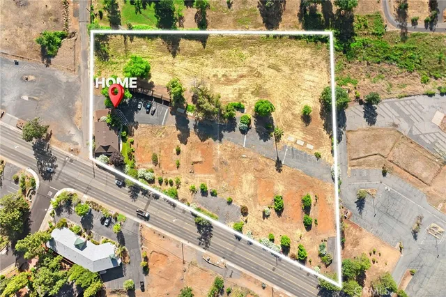 an aerial view of residential houses with city view