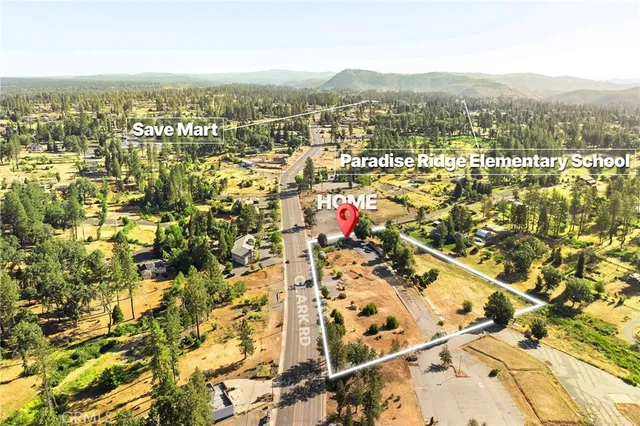 an aerial view of residential houses with city view