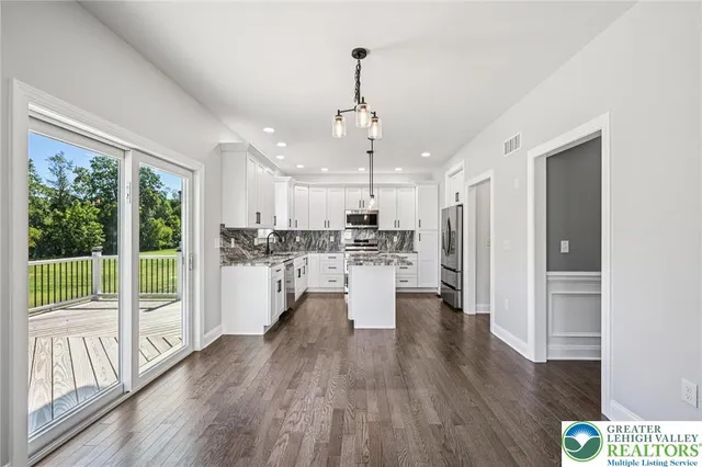 a view of kitchen with wooden floors and kitchen view