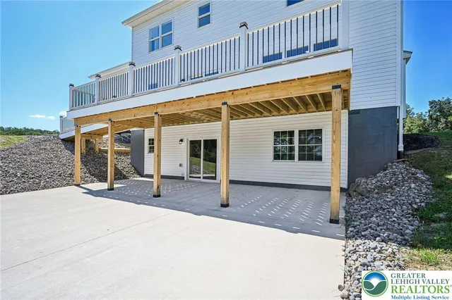 a front view of a house with sitting area