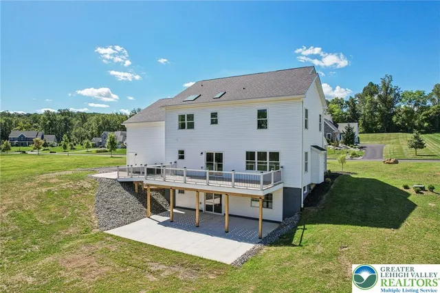 a view of a house with backyard porch and patio