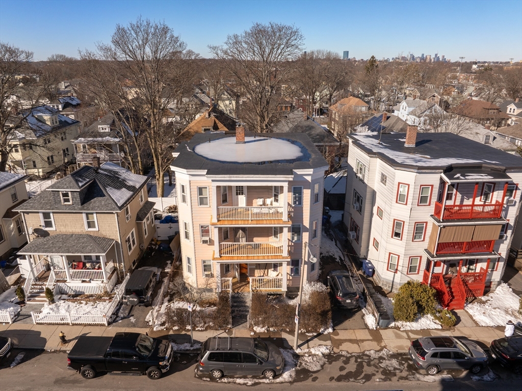 81 Mora Street Boston, MA 02124 - Photo 3 of 4 a view of a city that has a lot of cars parked on the road
