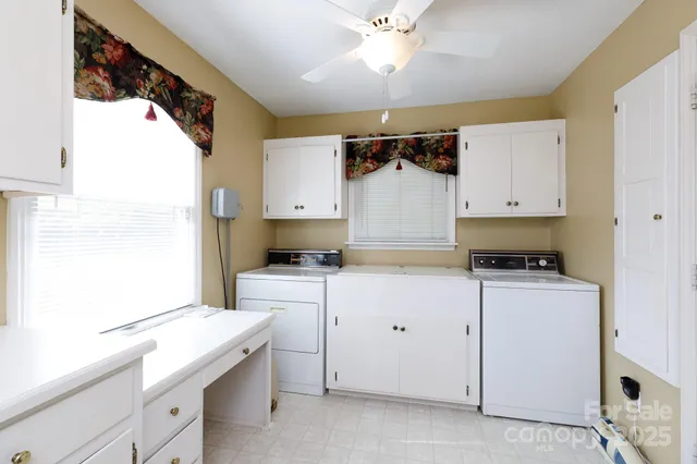 a kitchen with a sink cabinets and appliances