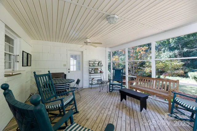 a outdoor living space with furniture and wooden floor