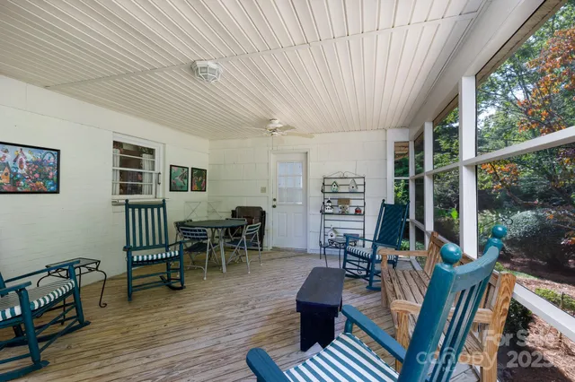a view of a livingroom with furniture and windows