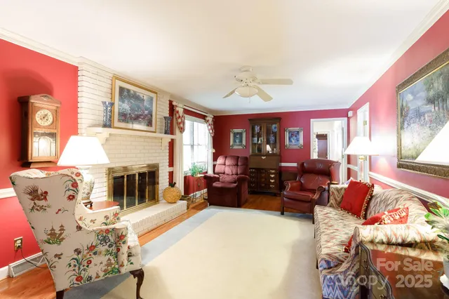 a living room with furniture fireplace and flat screen tv