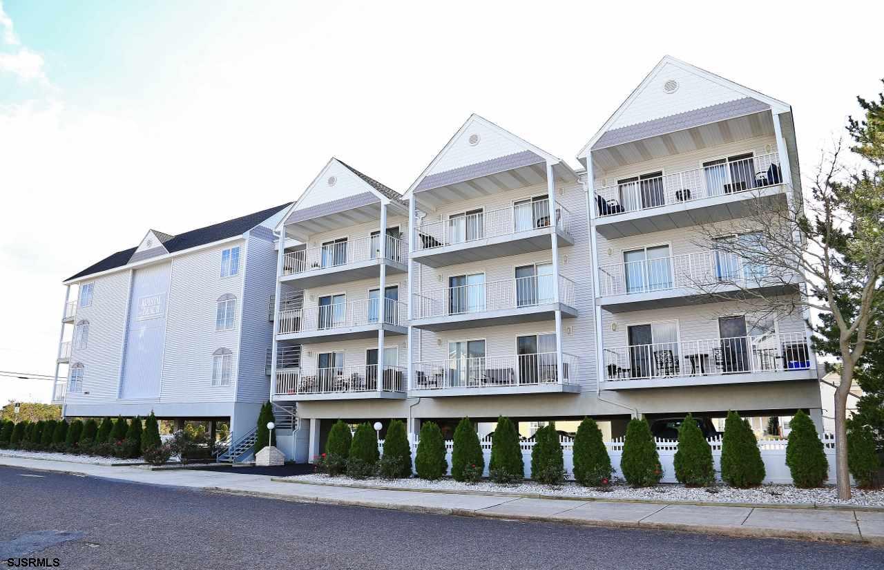 3901 Ocean Avenue, Unit 18 Brigantine, NJ 08203 - Photo 1 of 1 a front view of a building with a garden