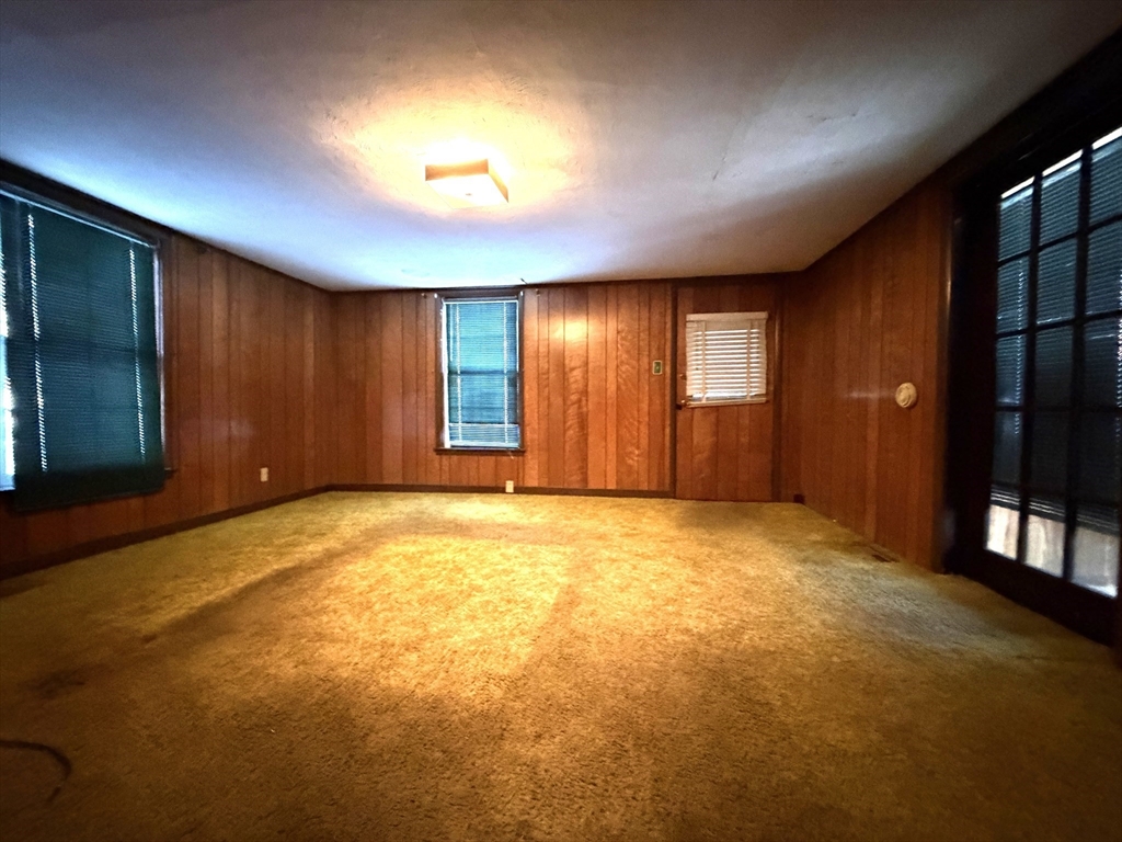 386 June Street Worcester, MA 01602 - Photo 8 of 16 a view of an empty room with a window