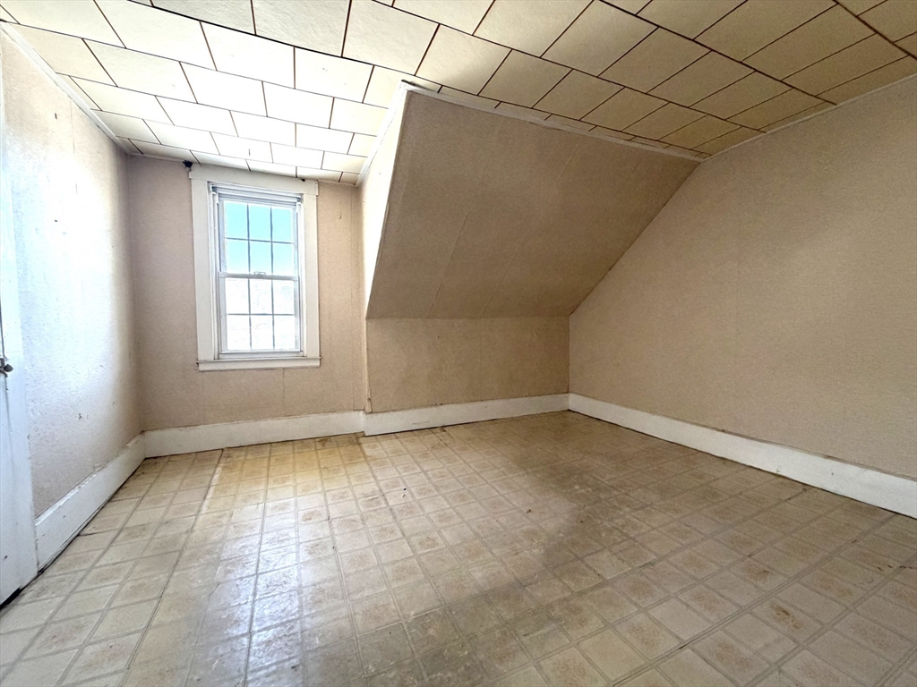 386 June Street Worcester, MA 01602 - Photo 9 of 16 a view of an empty room and window