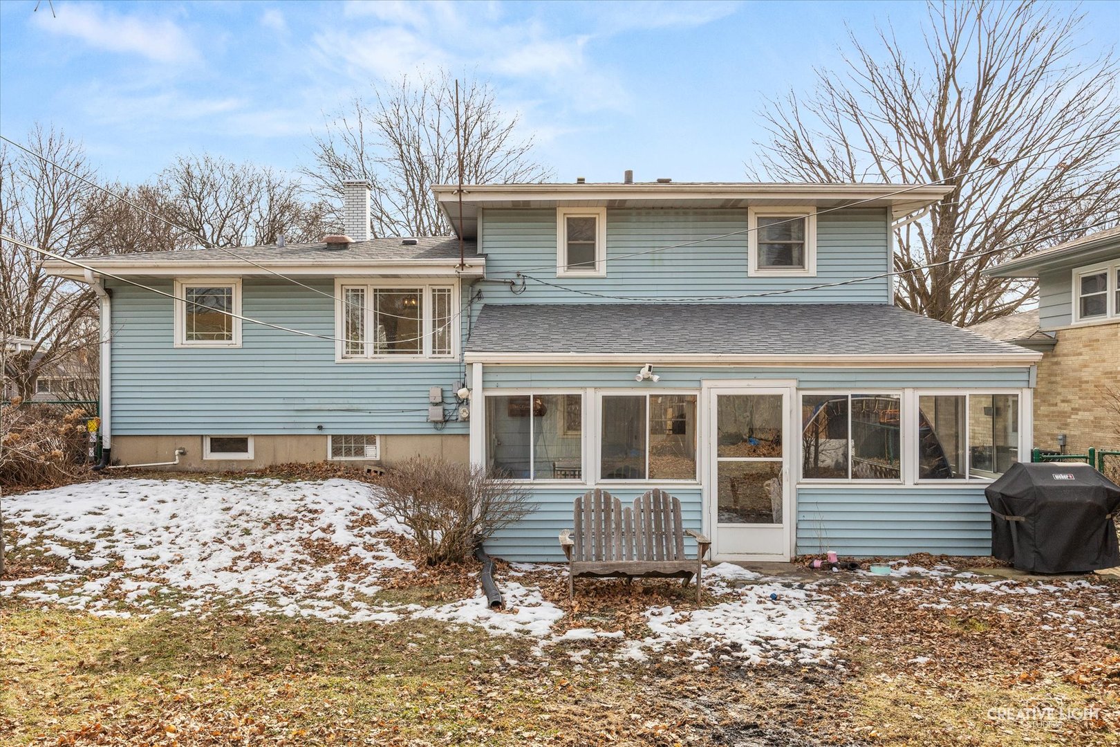 1019 Pershing Avenue Wheaton, IL 60189 - Photo 2 of 2 a front view of a house with a yard