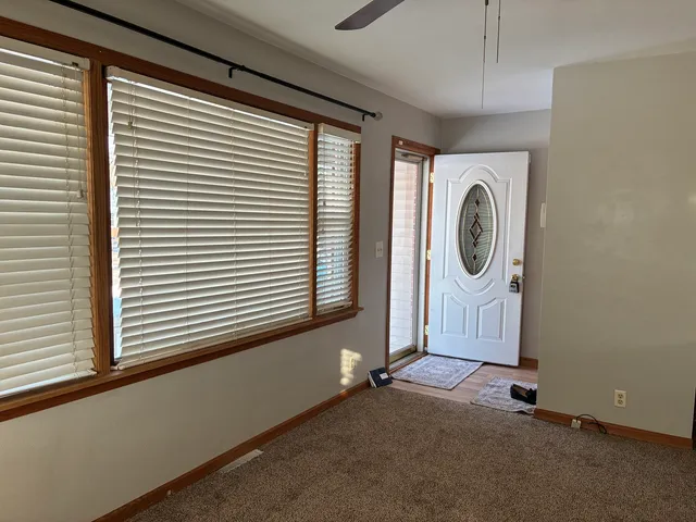 a view of a livingroom with washer and dryer