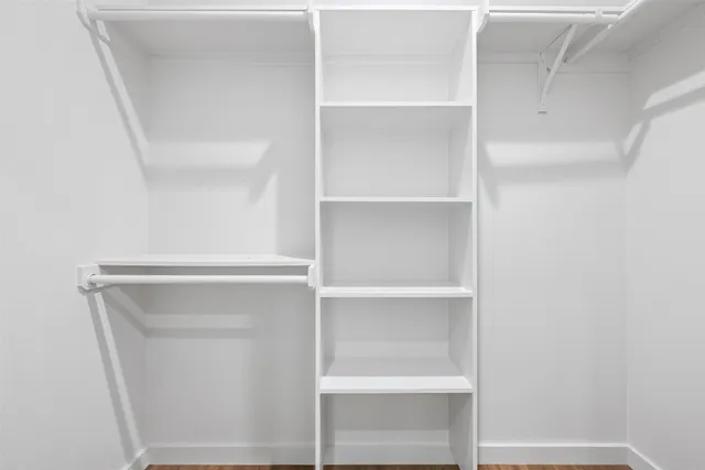 a view of an empty walk in closet